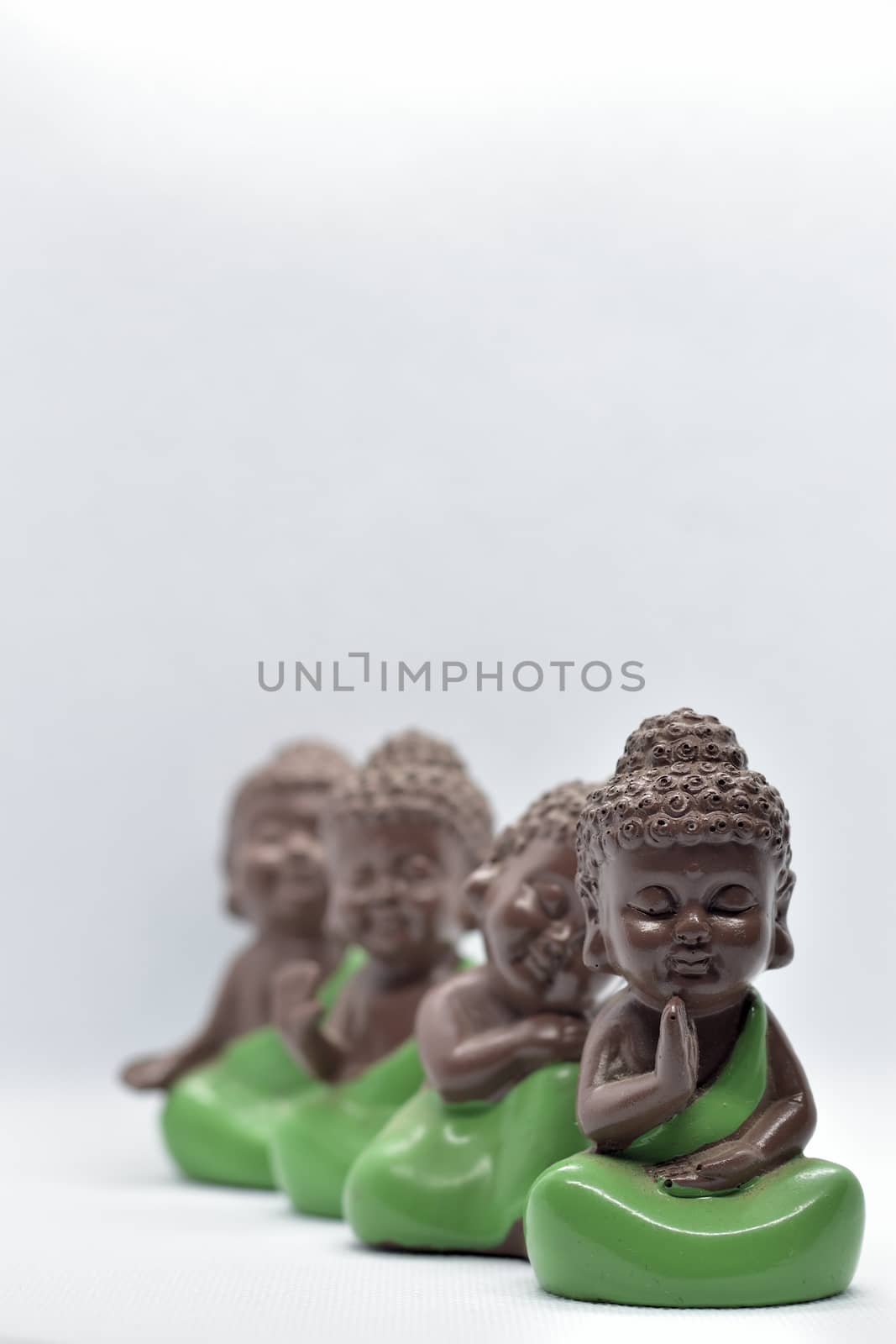 Four cute monk figures attract attention and also meaningful with modern simplicity