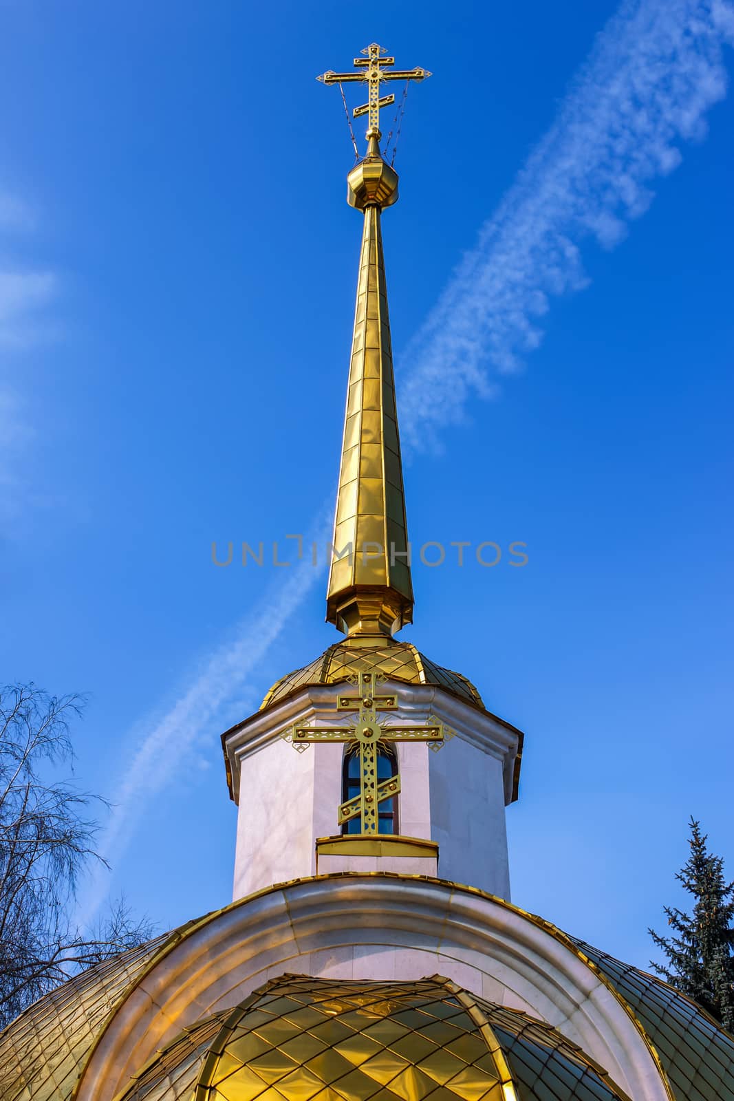 Golden Orthodox cross on the church tower
