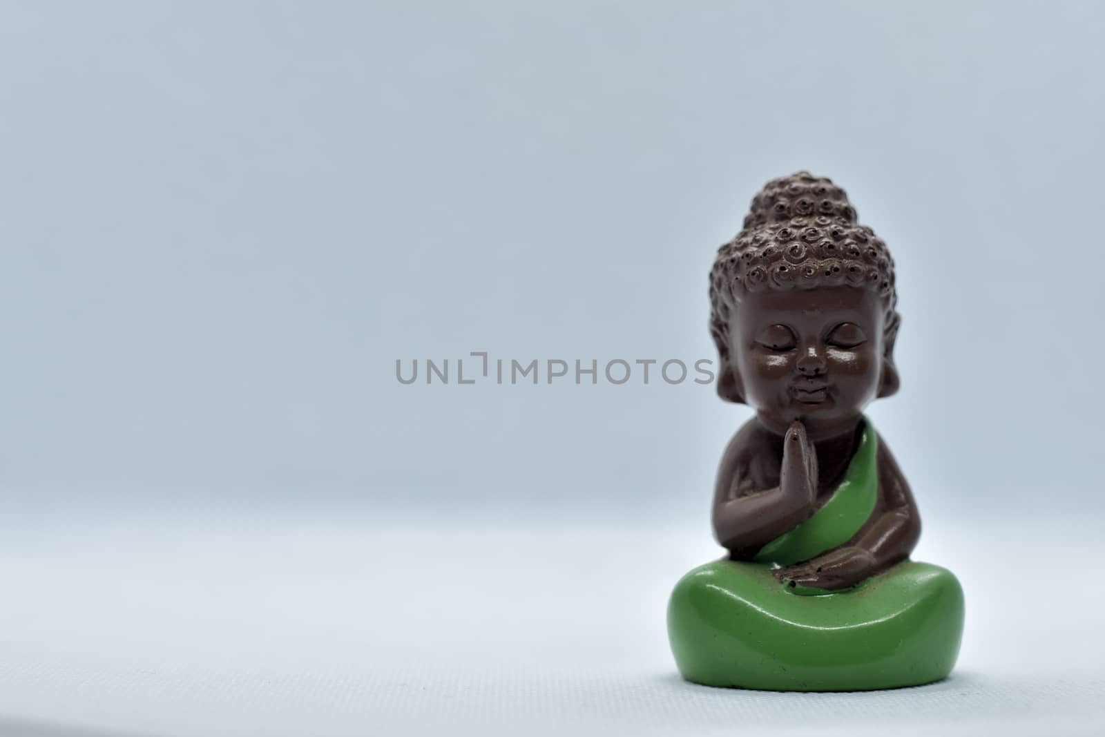 Buddha statues are taken as objects of great significance in Buddhism and followers of the religion. This ceramic miniature gives a fresh look to your set up.