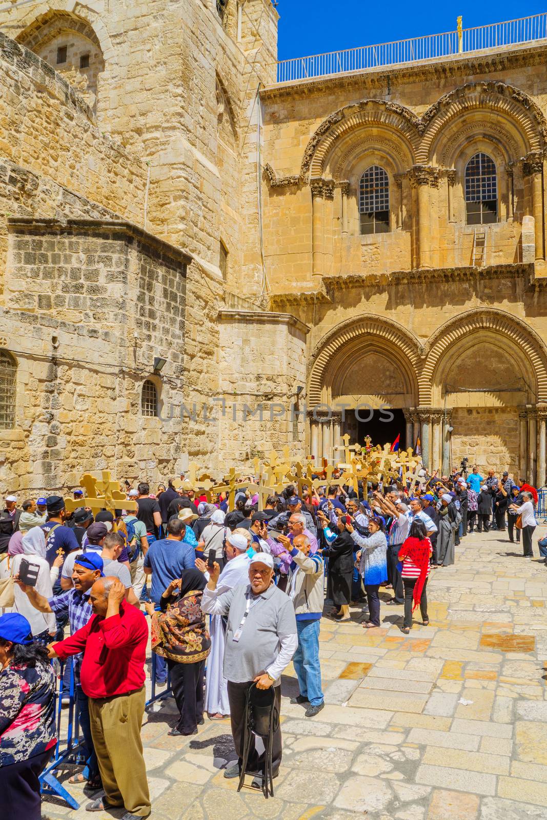 JERUSALEM, ISRAEL - APRIL 29, 2016: An Orthodox Good Friday scene in the yard of the church of the Holy Sepulcher, with pilgrims queuing at the entrance. The old city of Jerusalem, Israel