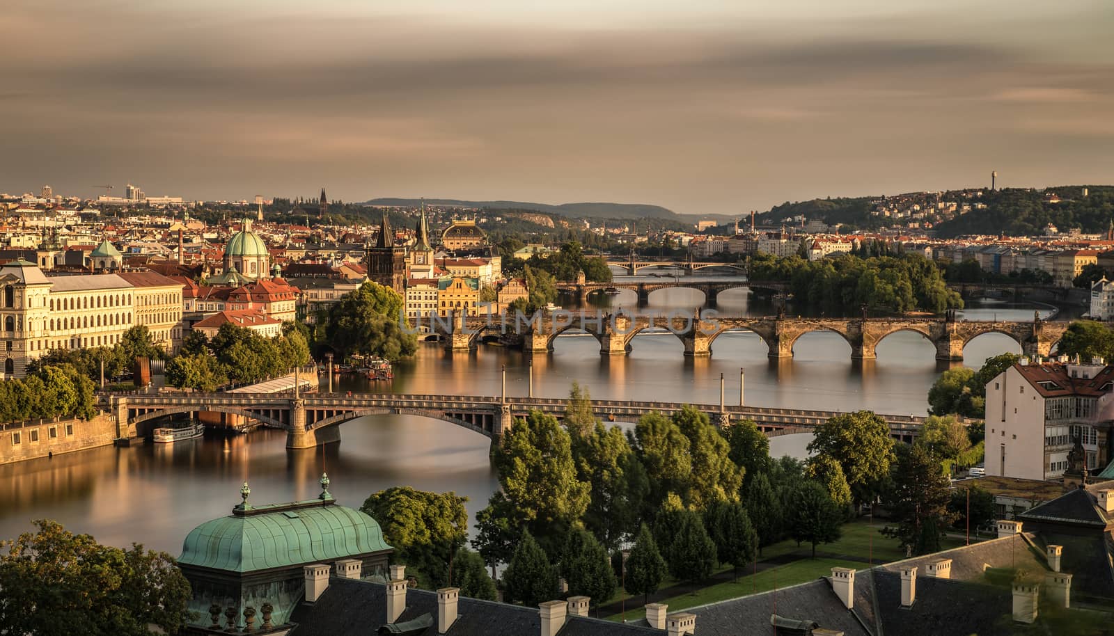 Historic bridges of Prague at the golden hour photographed from Letna park. Long exposure.