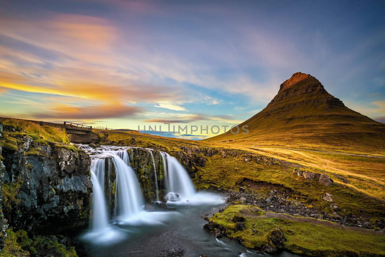 Sunset over Kirkjufellsfoss Waterfall in Iceland by nickfox