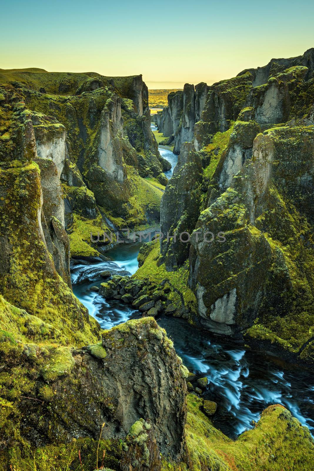 Deep Fjadrargljufur canyon and river flowing along the bottom of the canyon in south east Iceland. Long exposure.