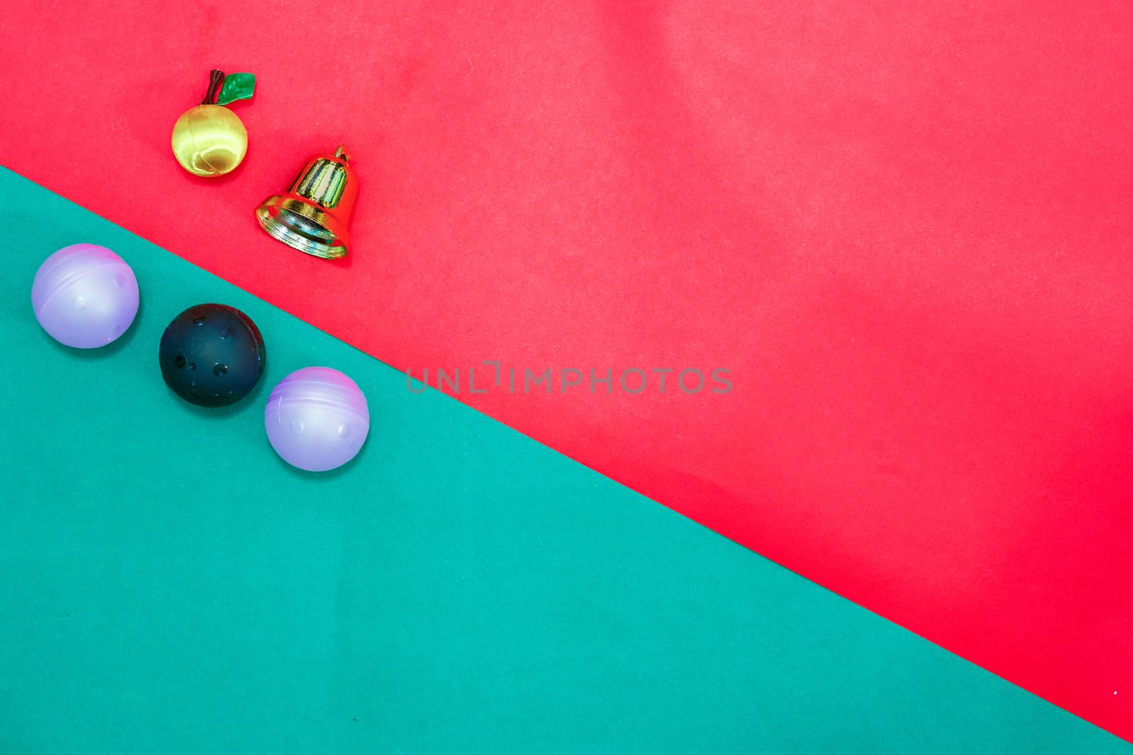 Christmas baubles and bell on Red green background,top  view with copy space