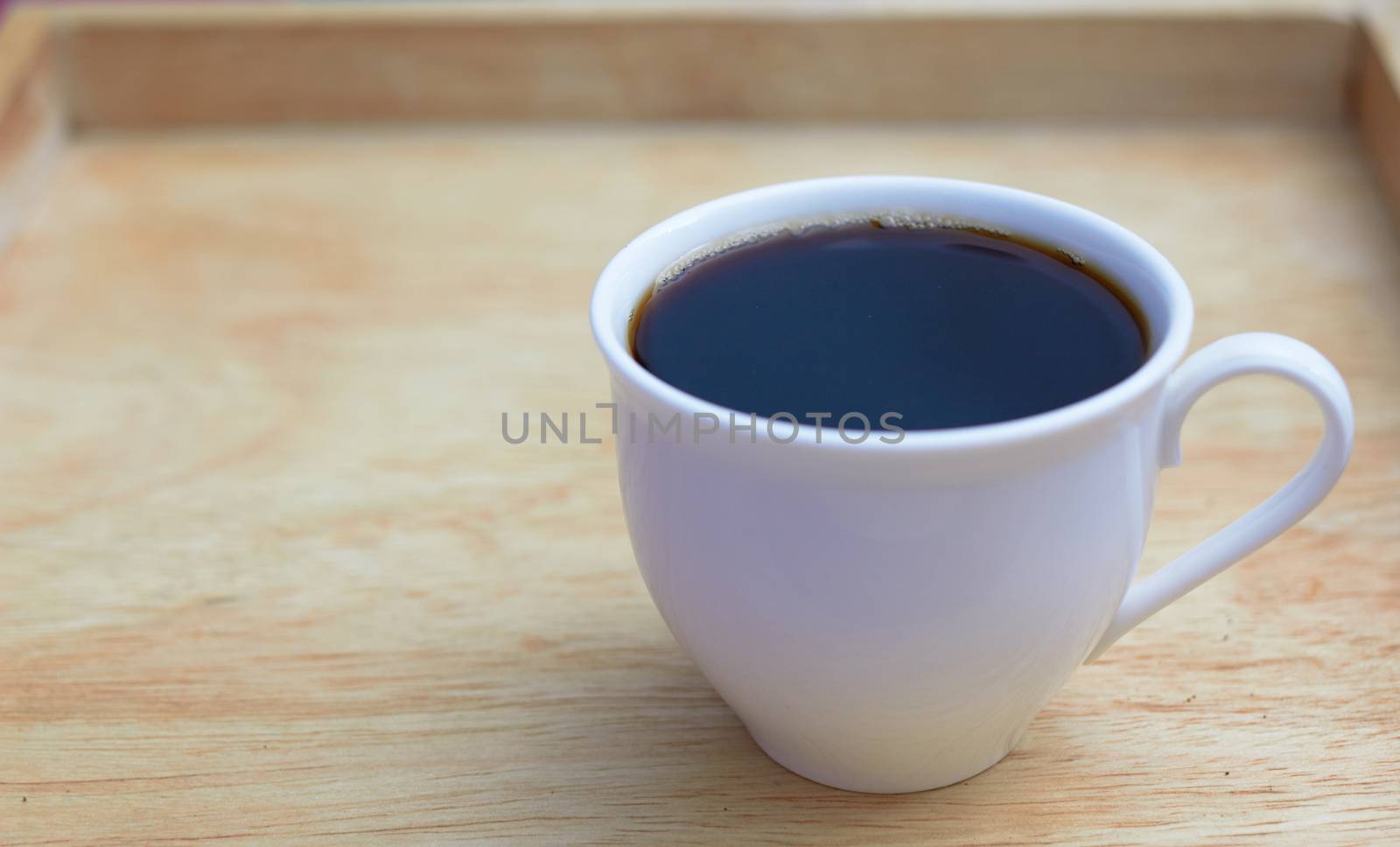 coffee cup in wooden background