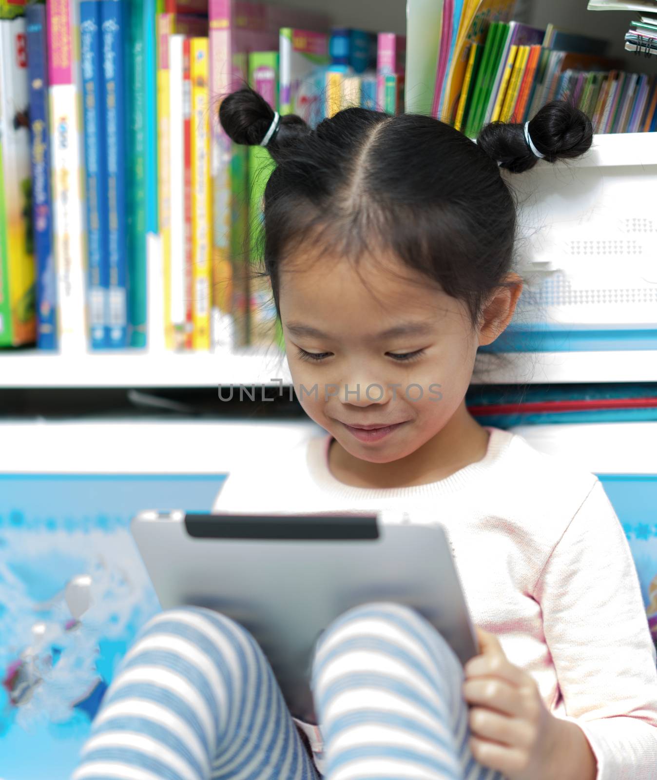 asian thai girl child kid sit book self happy to reading tablet