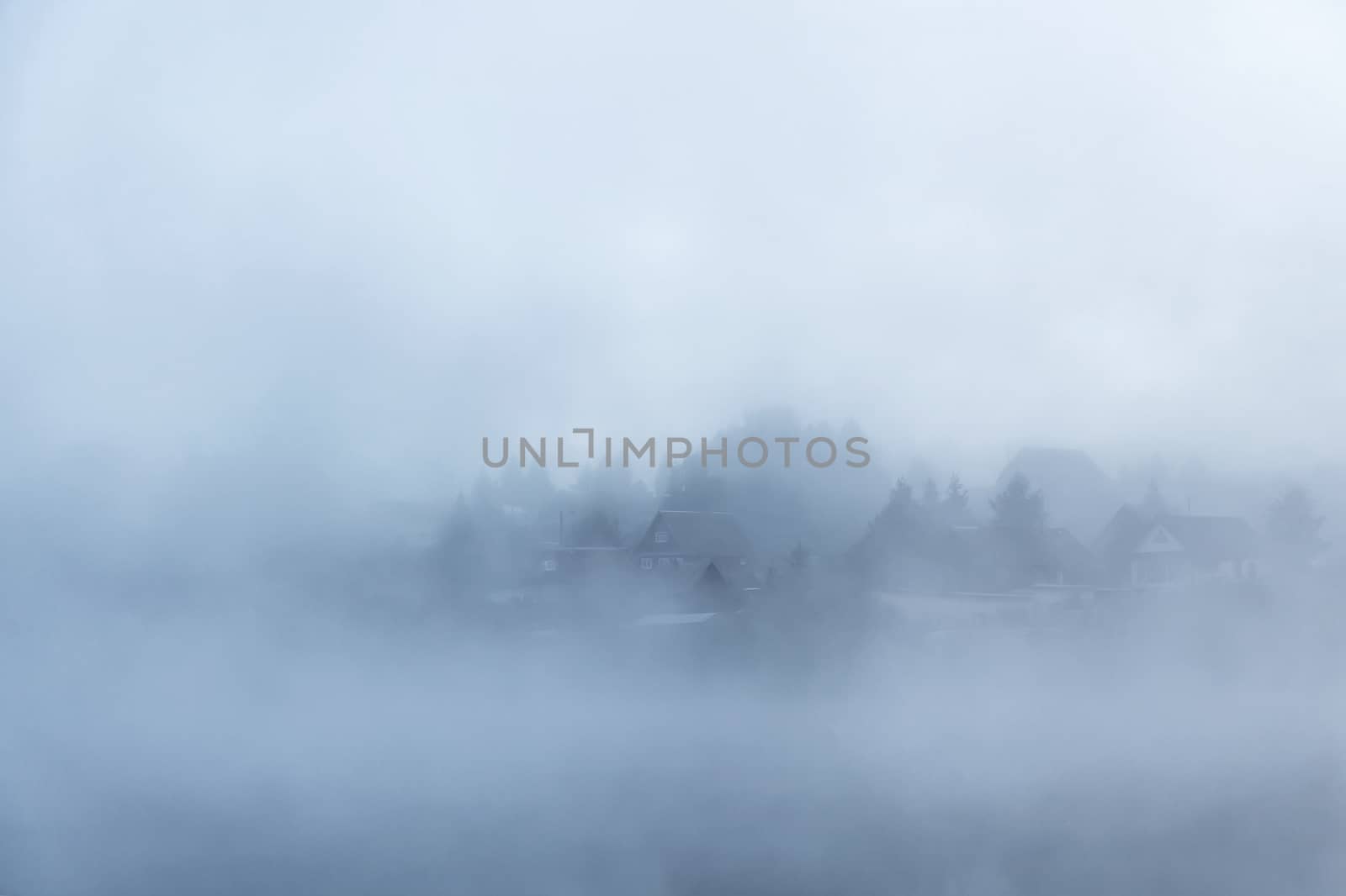 River before sunrise in the fog by sveter