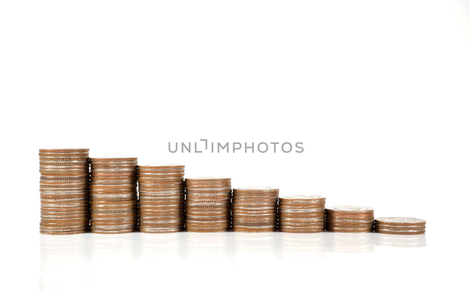 Savings, increasing columns of coins isolated on white background