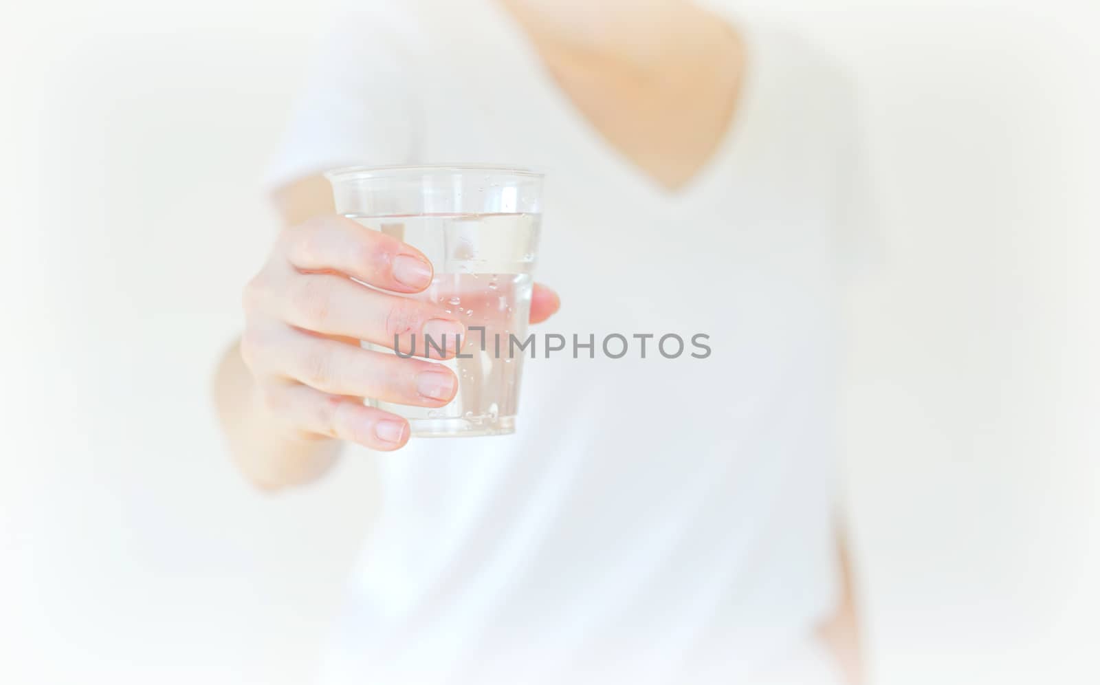 Healthy Young Woman with glass of fresh Water