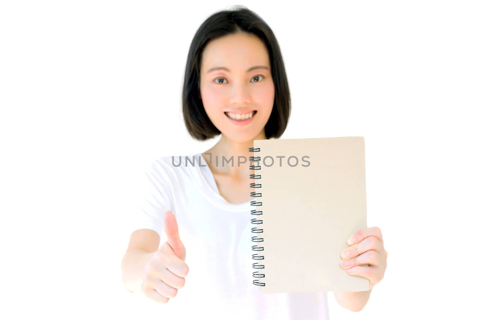 Young Asian girl show thumb isolated on white background.