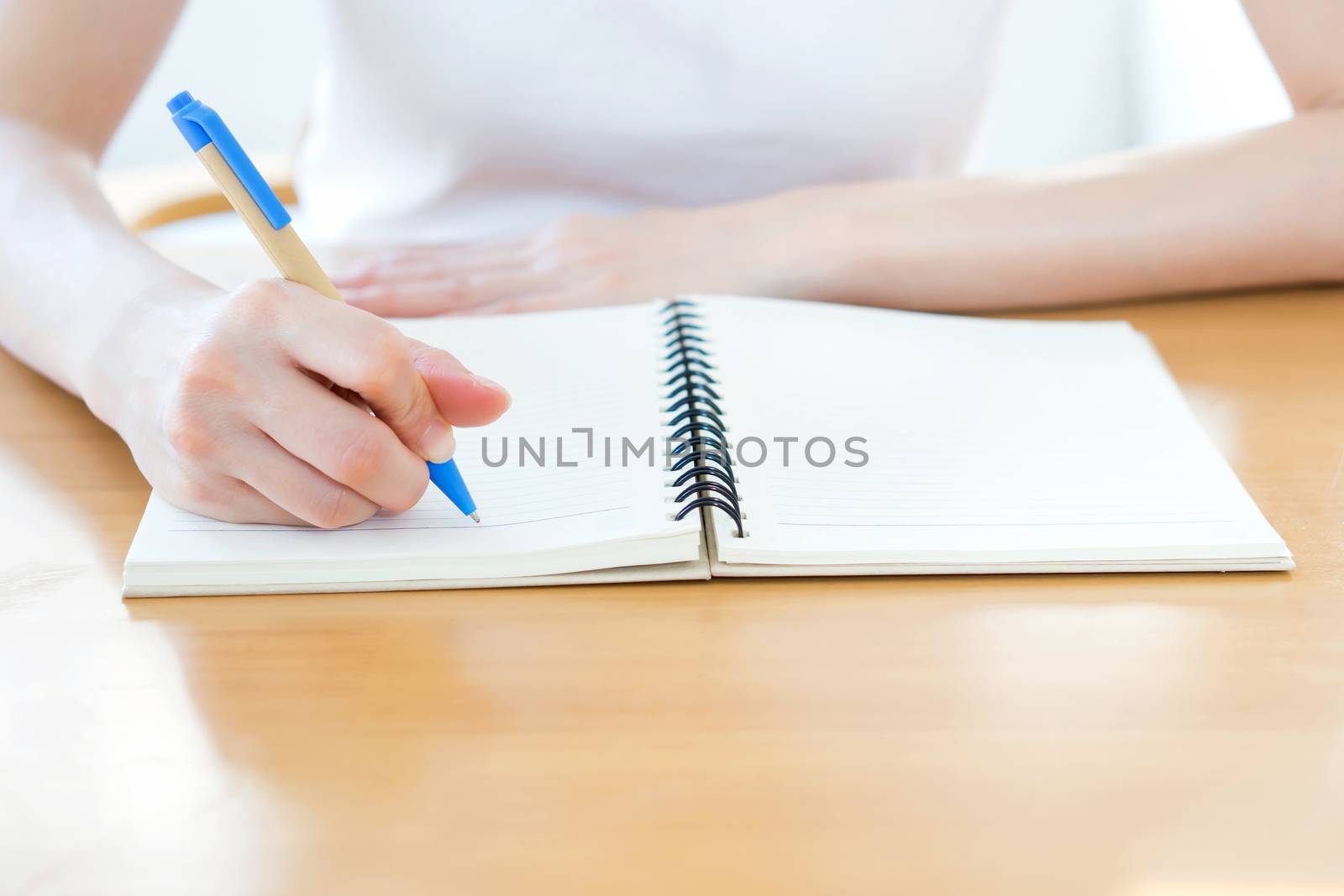 handwriting, hand writes a pen in a notebook