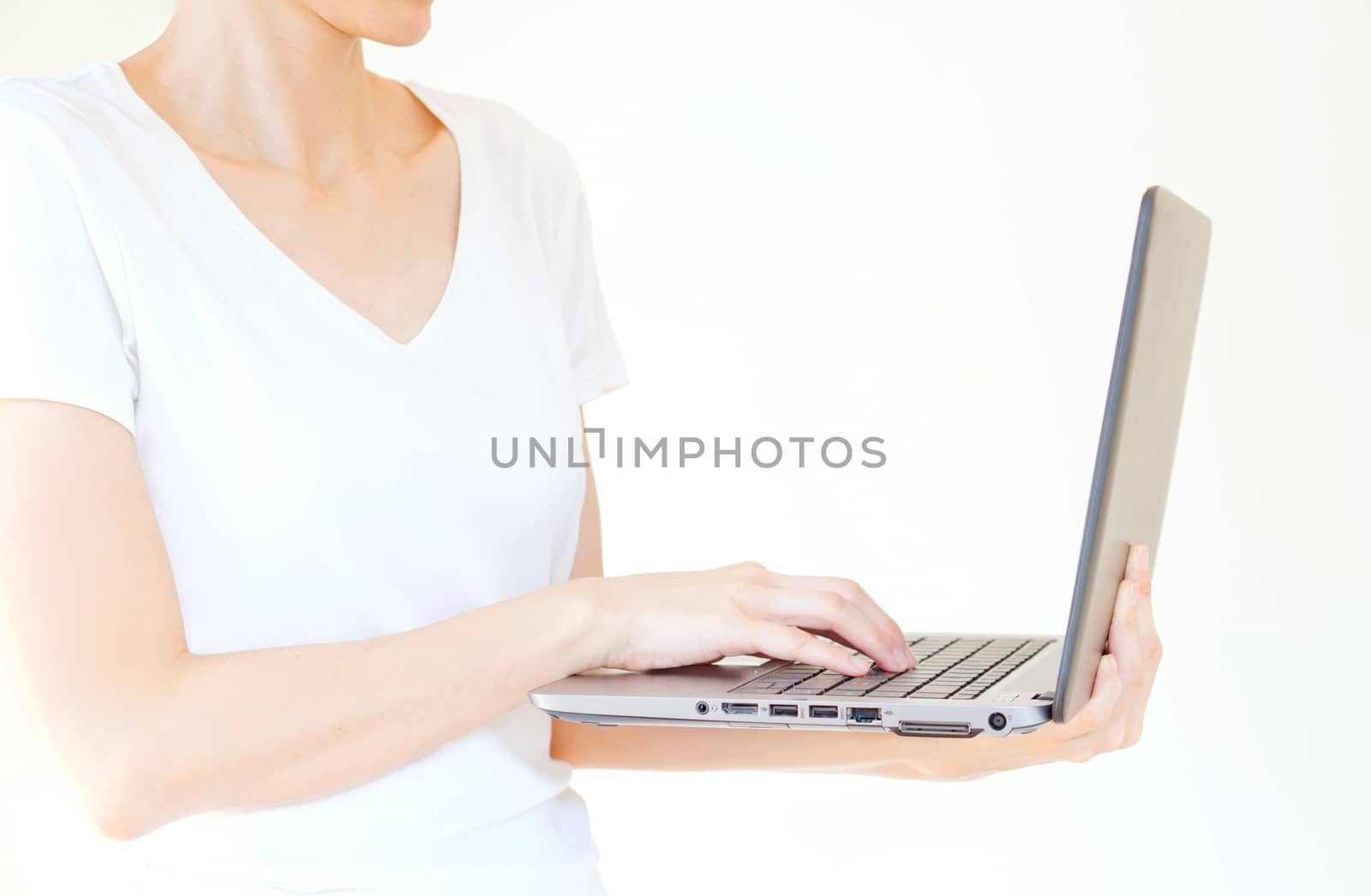 male hand holding a laptop, isolated on white