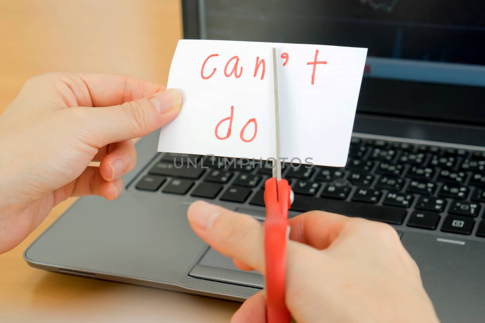 holds card with text can't do on computer