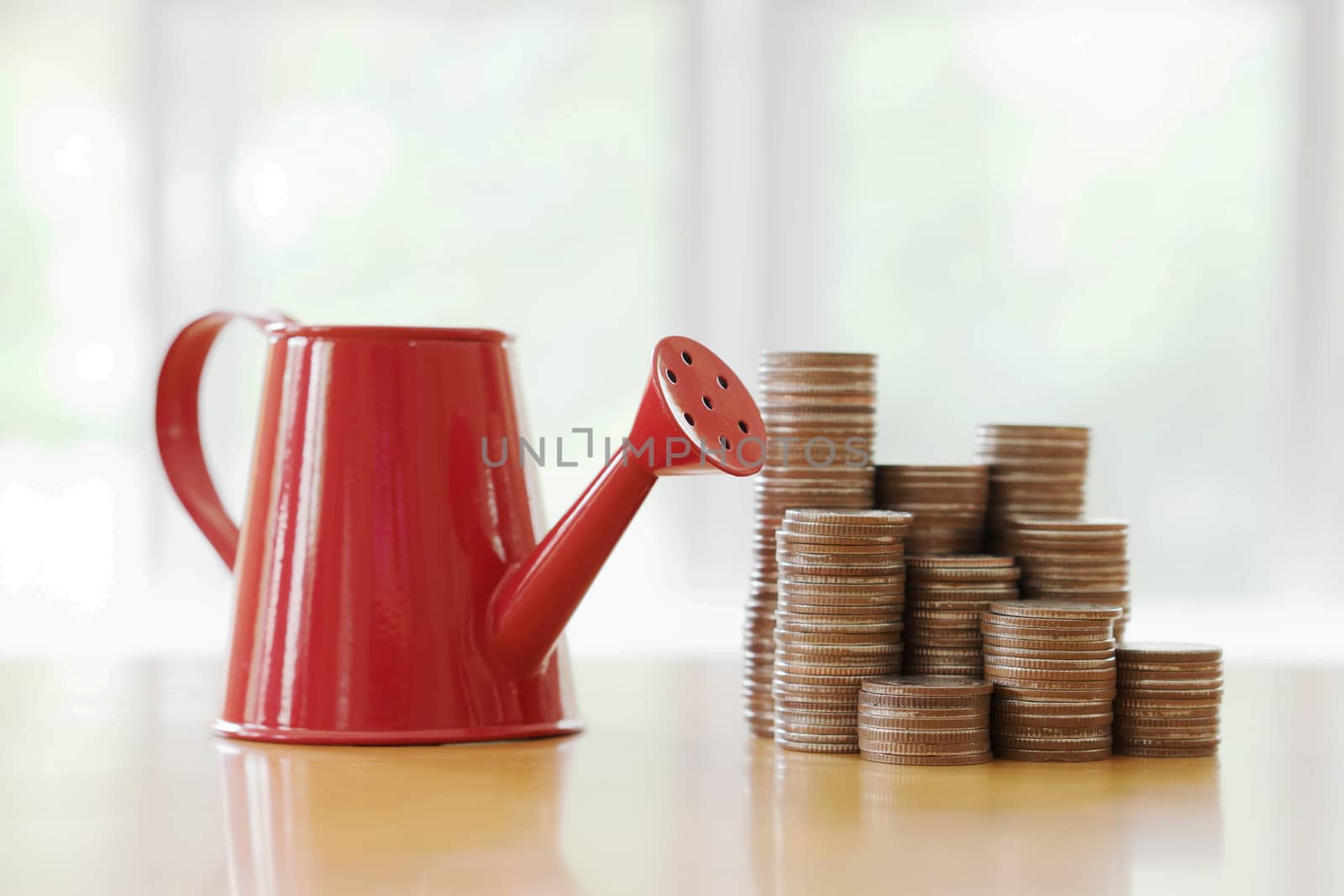 Red watering can with coin (path in side) isolate