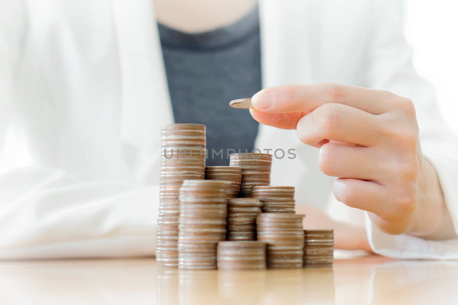 Young Happy Businesswoman Putting Coin 