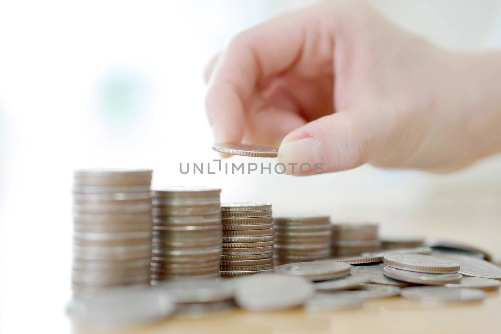 Hand human hand putting coin to money, business ideas