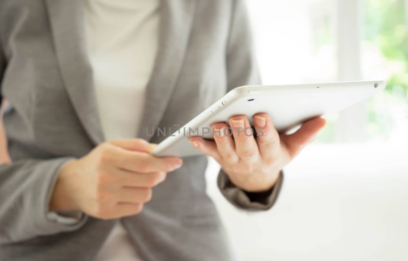 Businesswoman holding tablet in hands