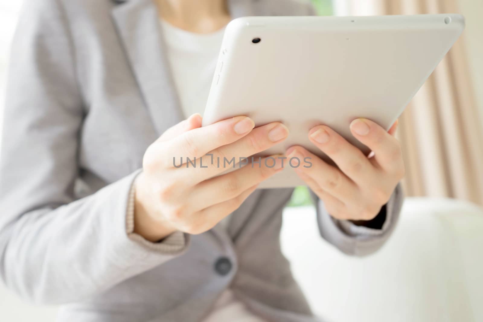 Woman using a tablet computer.