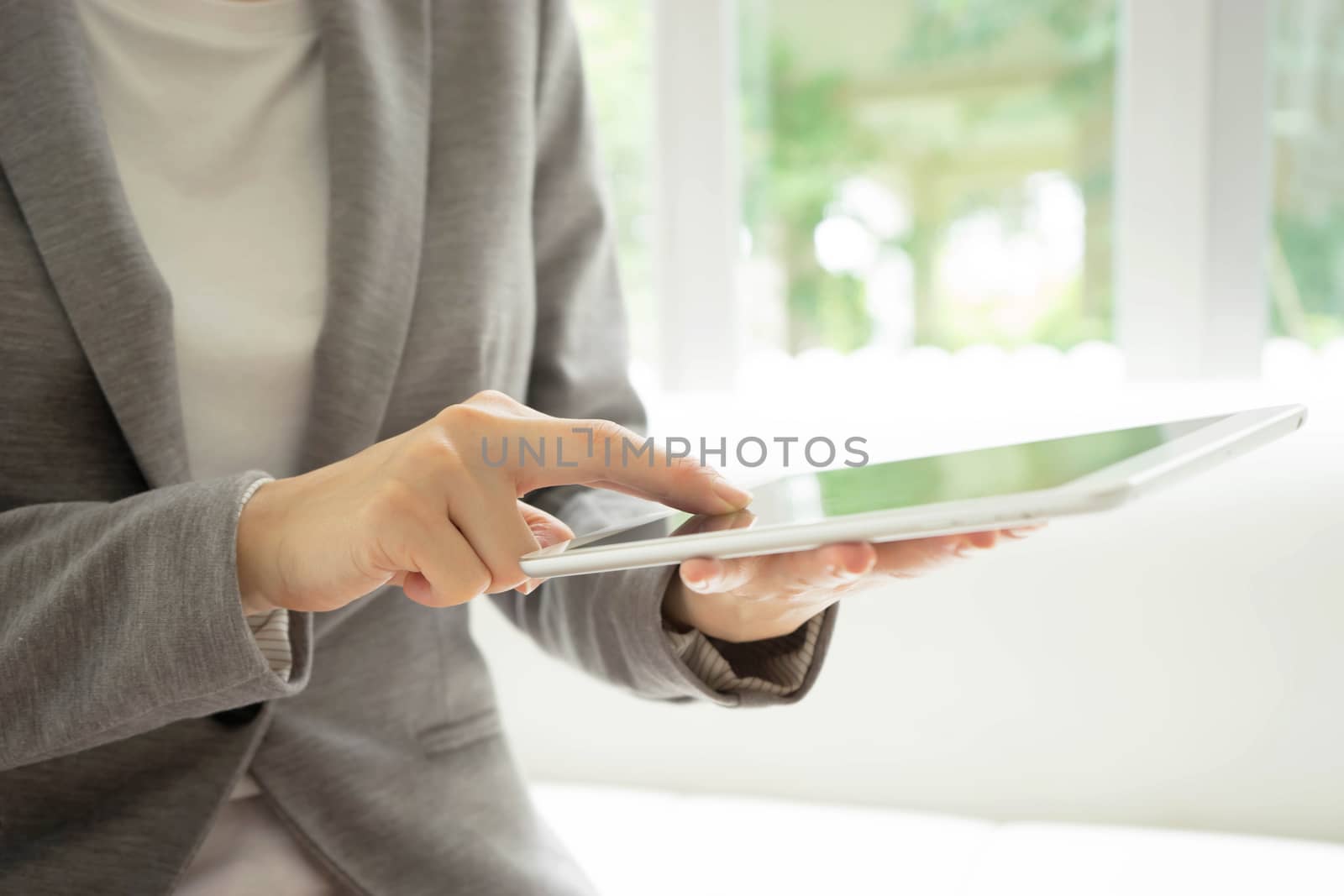 Businesswoman holding tablet in hands