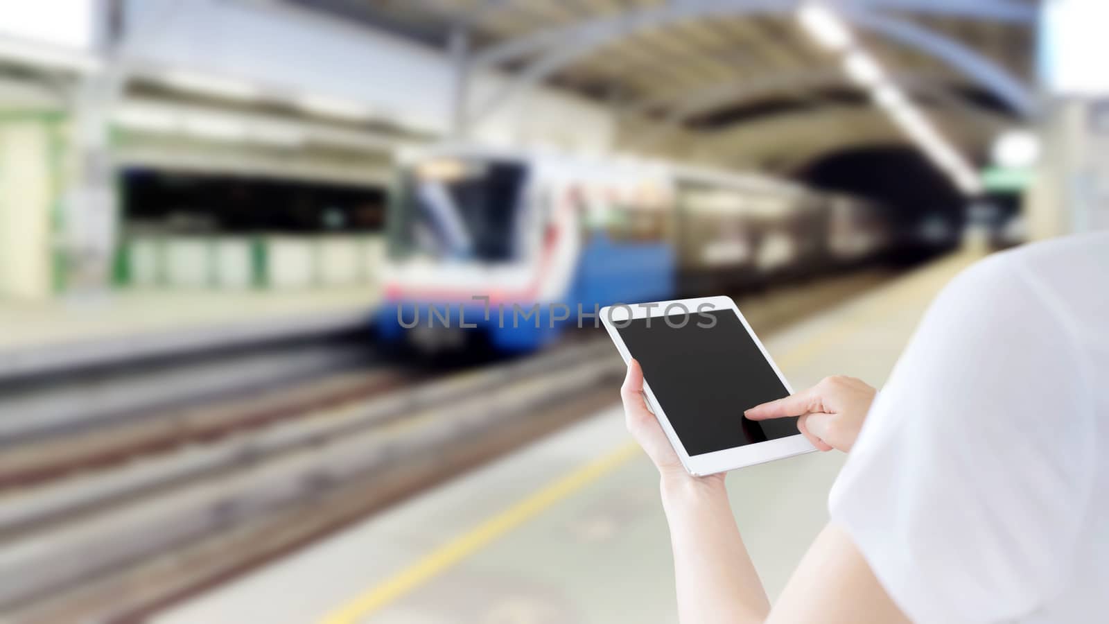 Hand are holding and touch Smartphone with sky train background