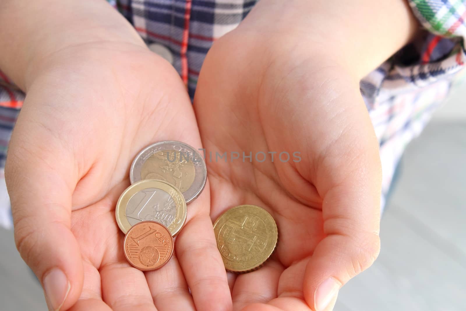 Child's hands with money