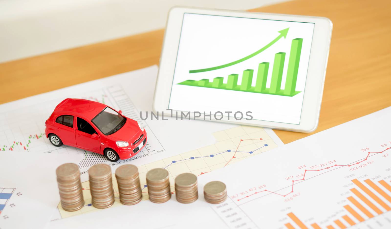 Photo of document some graphics with calculator and car and money