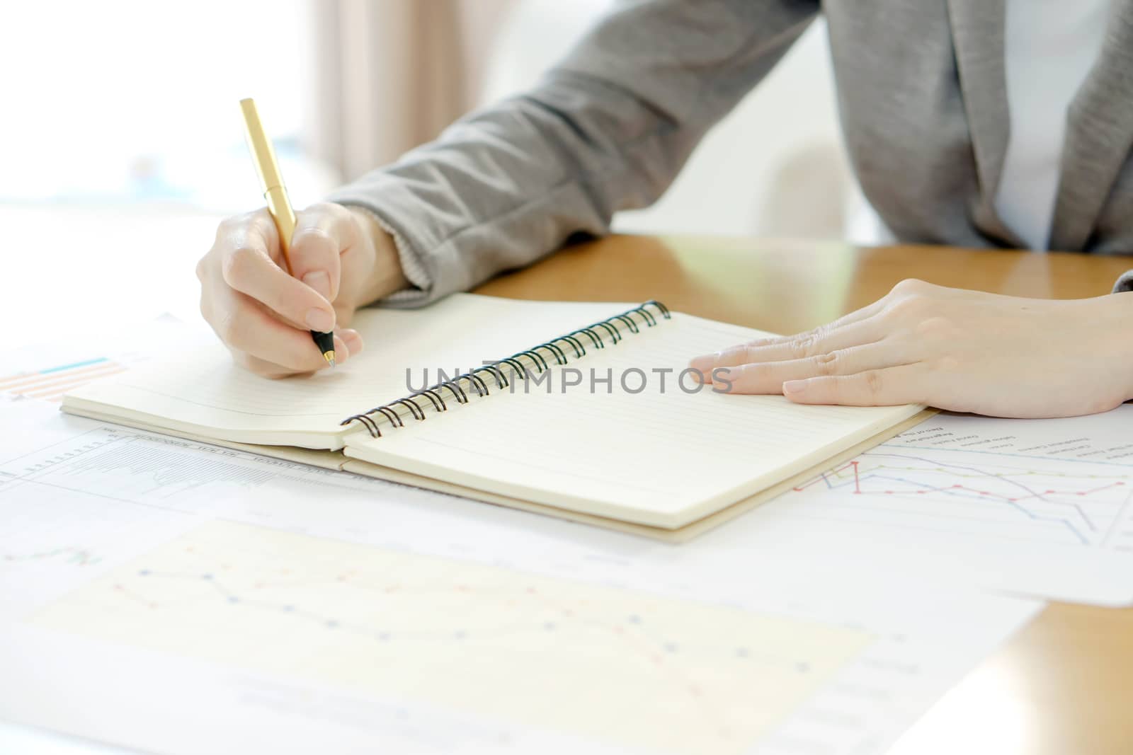 picture of woman hand with calculator and papers