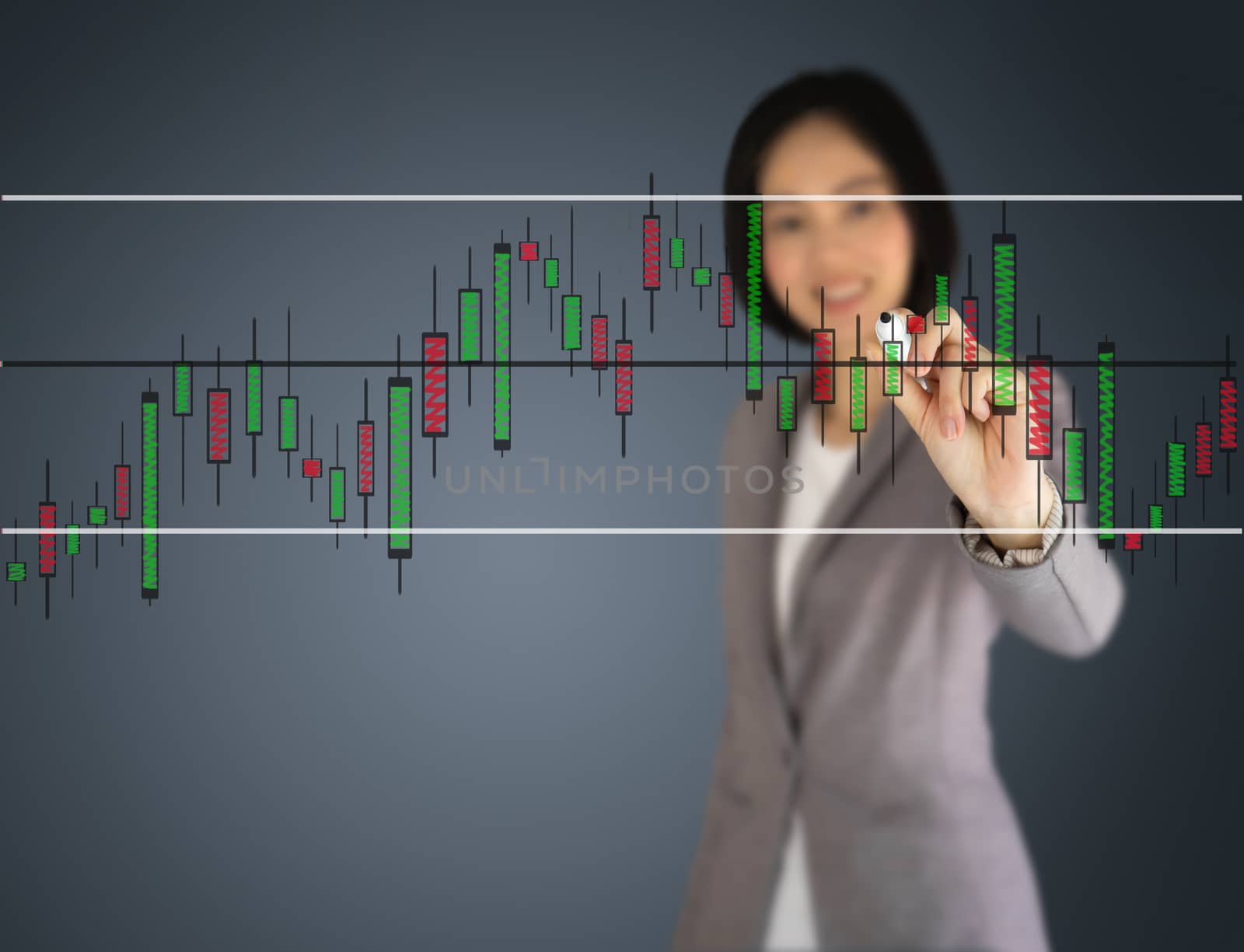 Young beautiful businesswoman drawing a graph