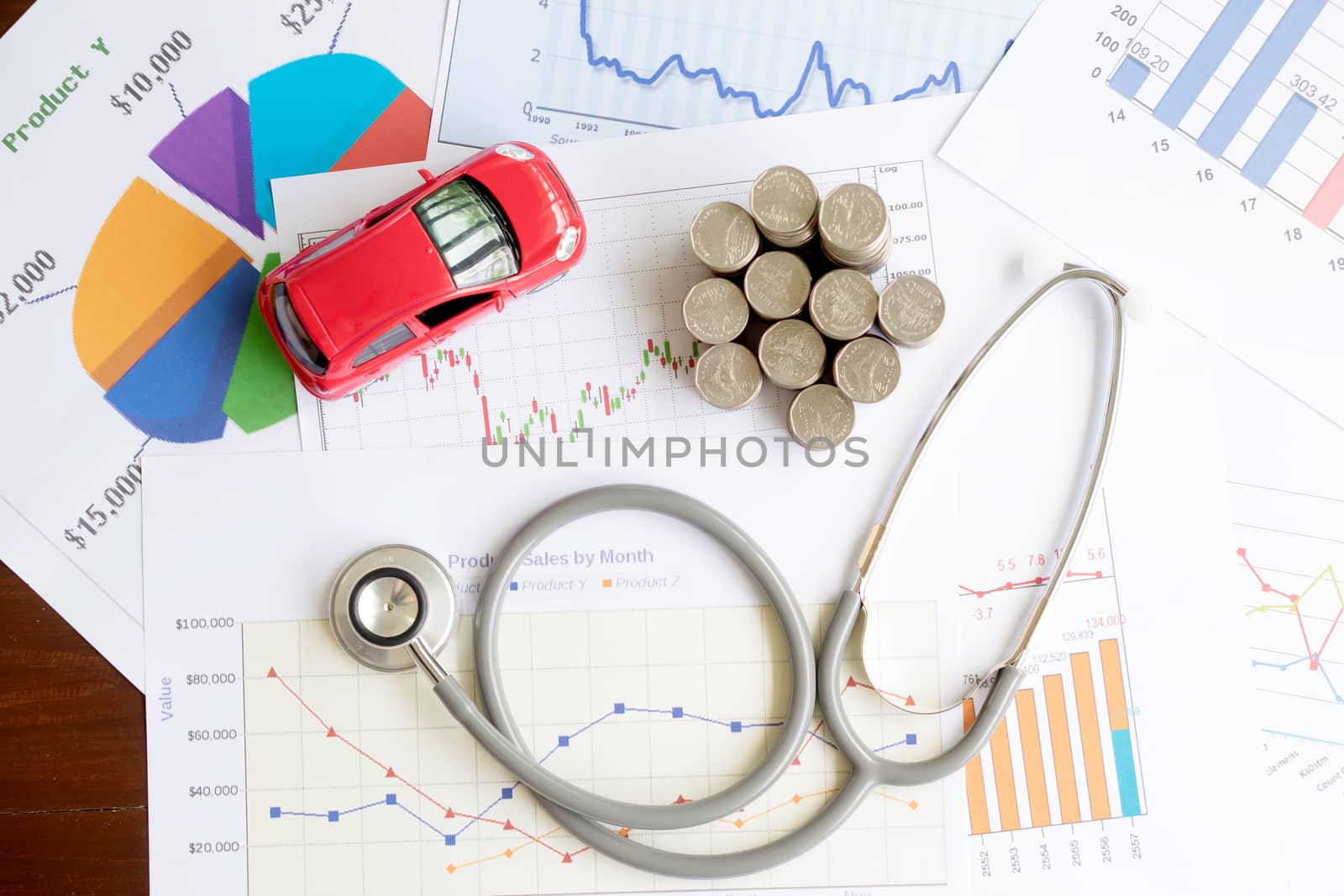 stethoscope car graph and coin