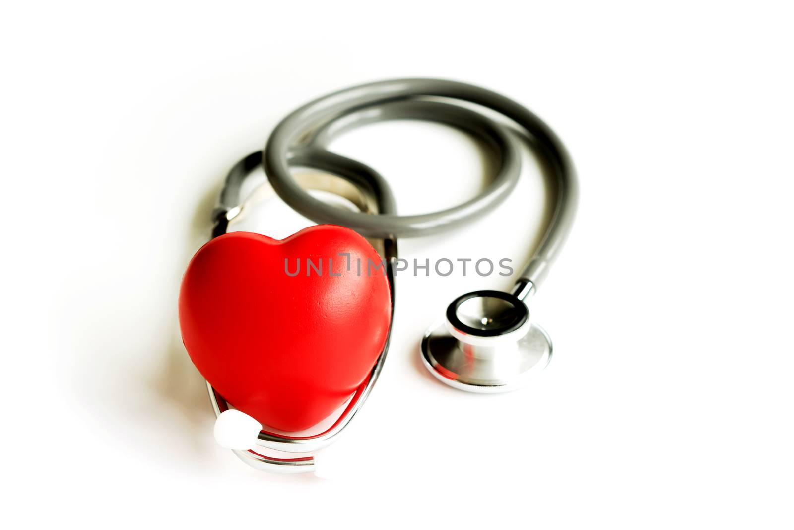 Stethoscope with heart isolated on white background