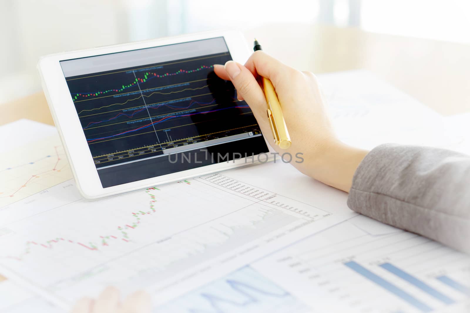 Close-up Of Businesswoman With Digital Tablet And Document