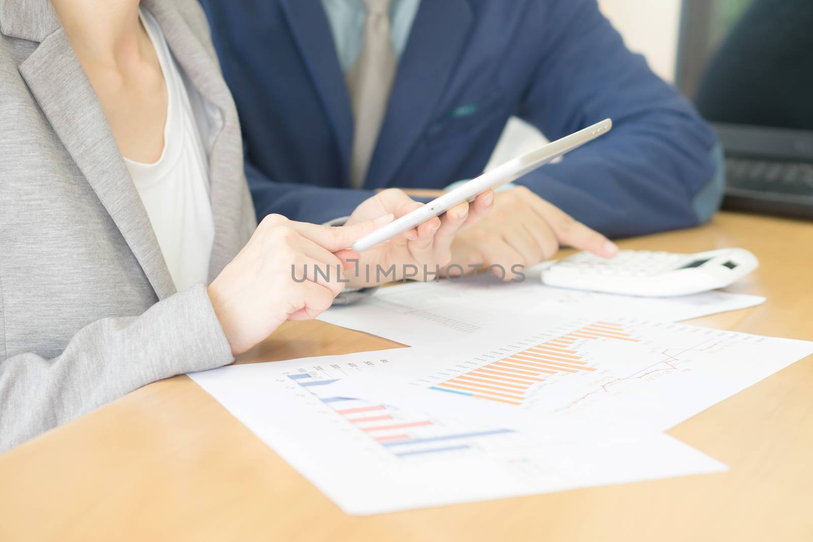 Business adviser analyzing financial figures denoting the progress in the work of the company