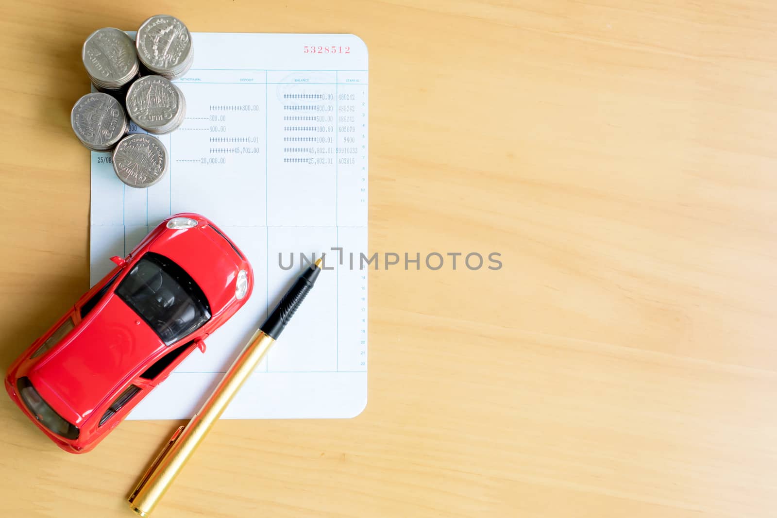 Coins stack in columns, saving book, car. Finance and banking concept.