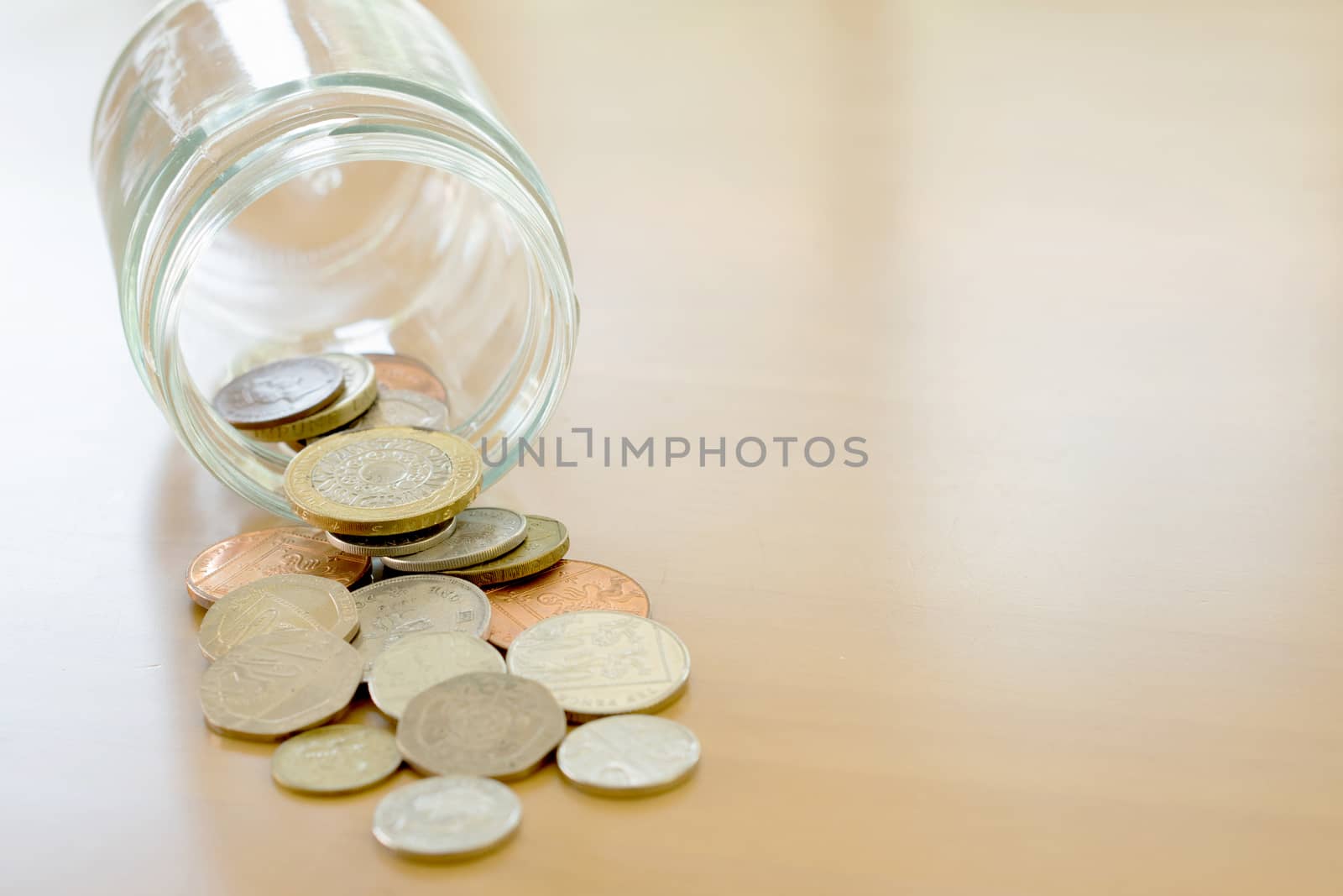 Savings Jar and British Coins by ekachailo
