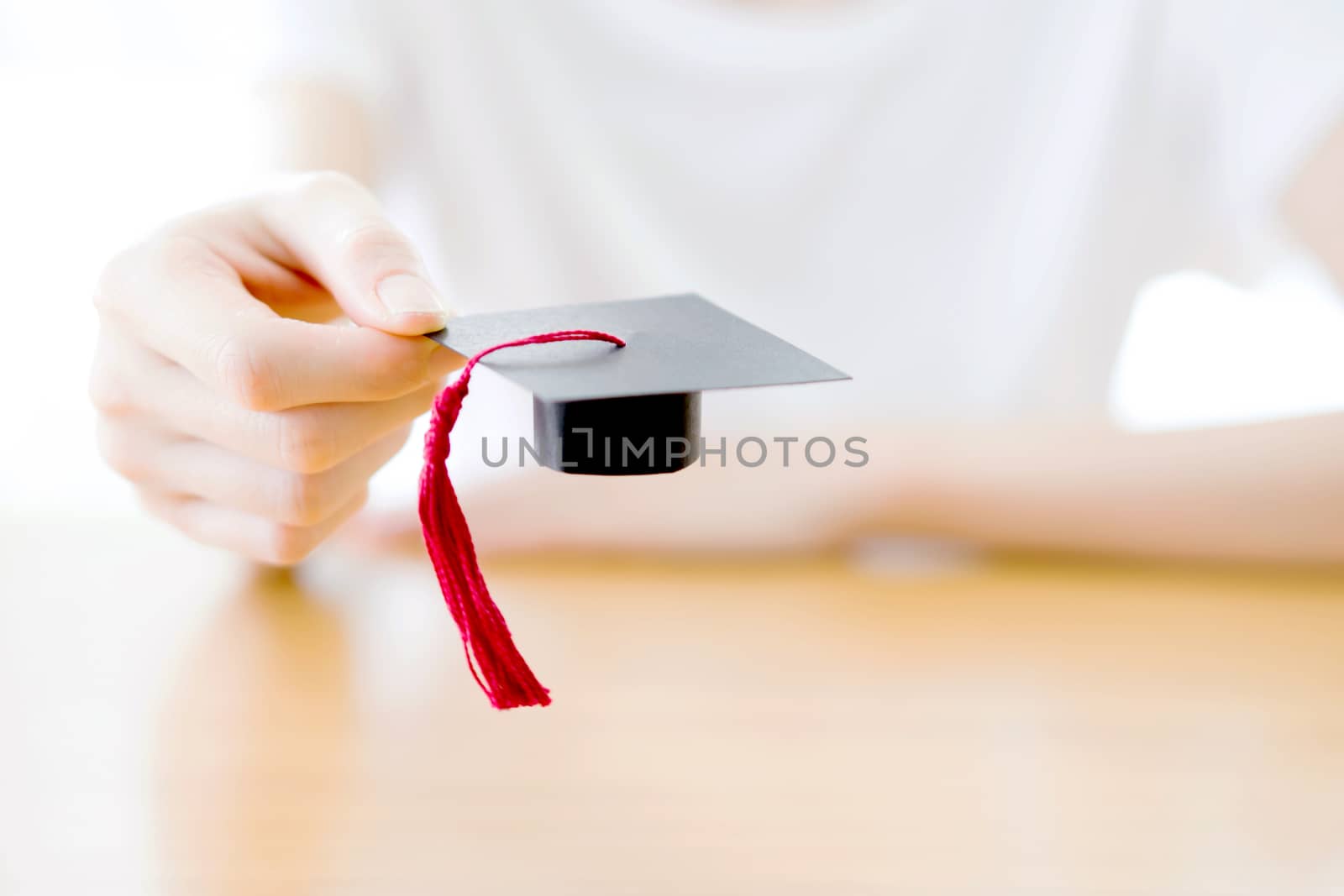 woman holding graduation cap