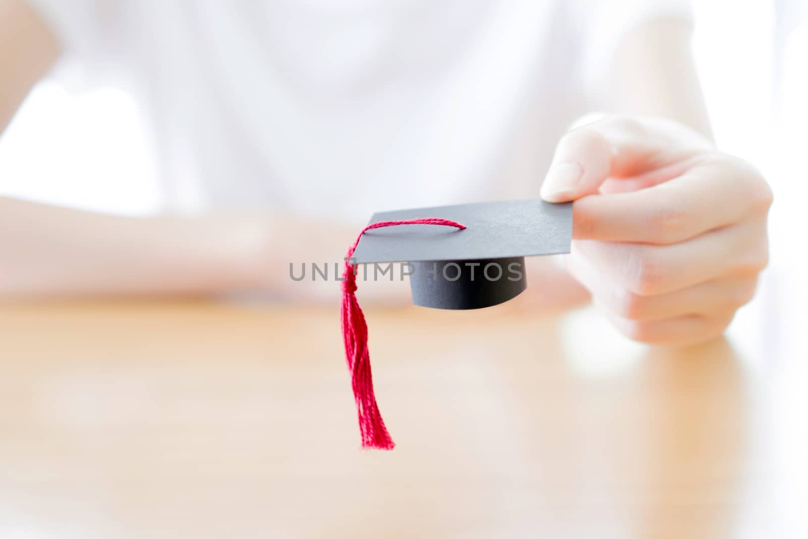  woman holding graduation cap