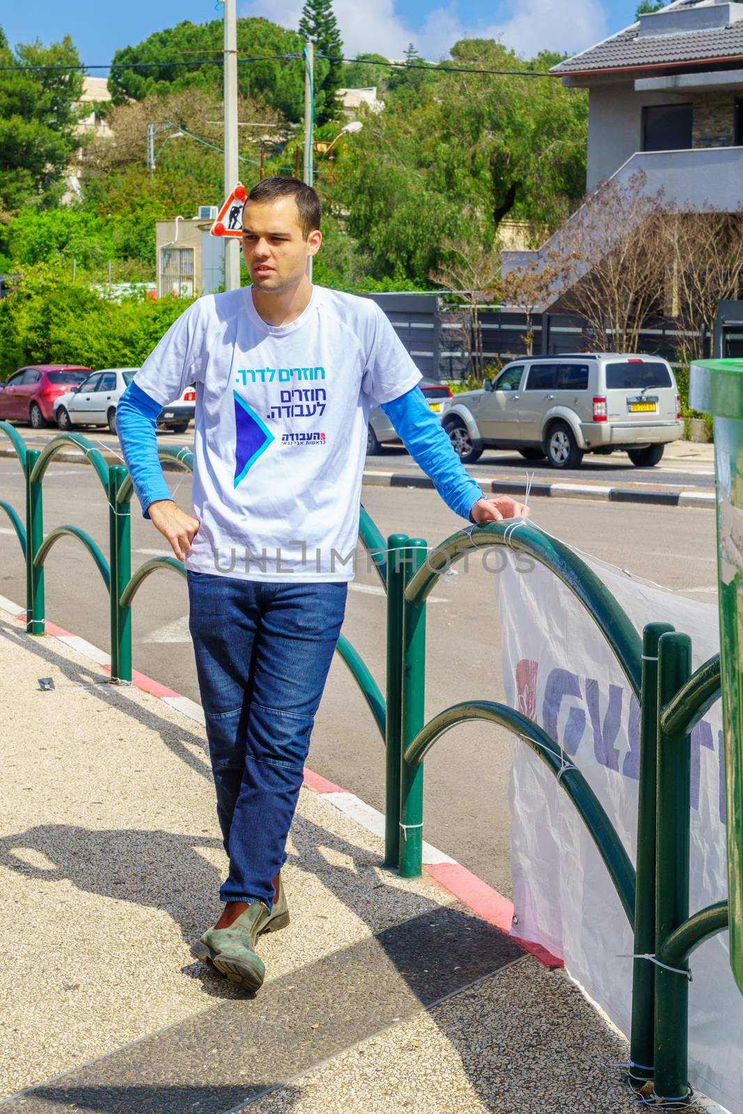 Haifa, Israel - April 05, 2019: Political activist in Ziv square, 4 days before the 2019 elections, in Haifa, Israel