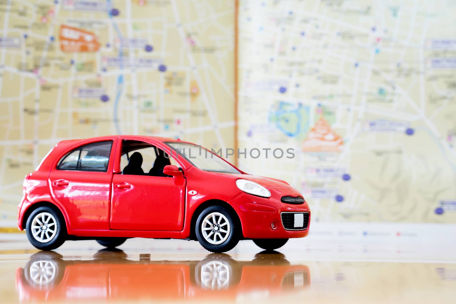 Toy red car on vacation 