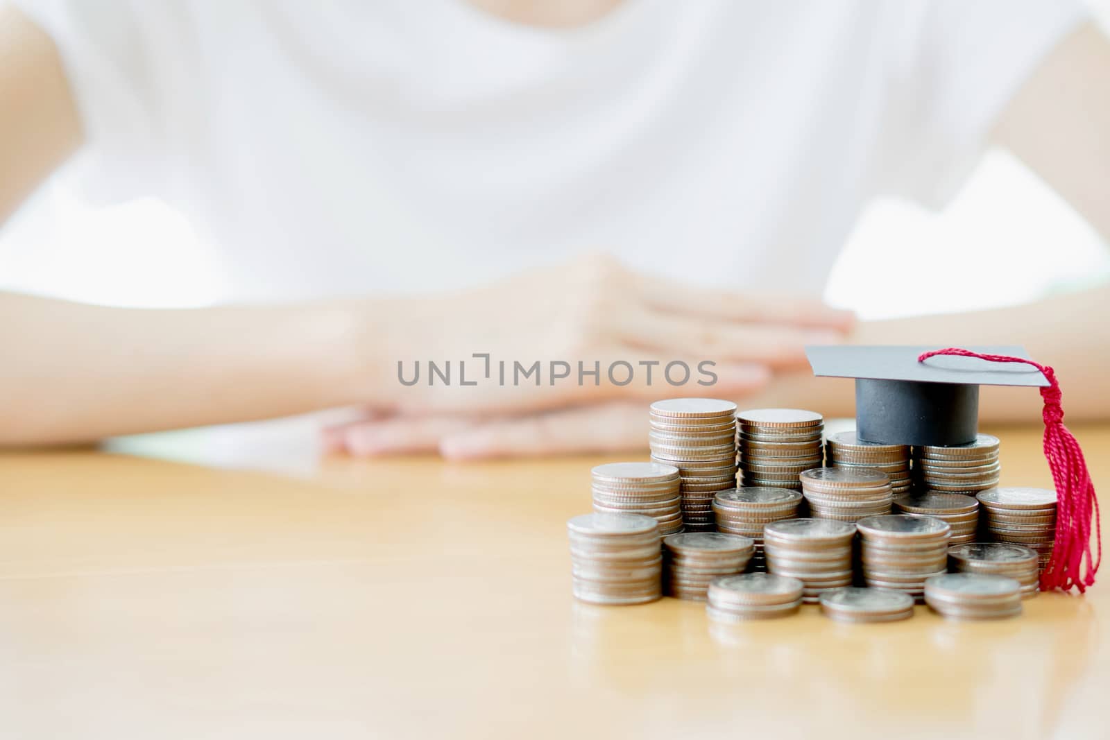 Woman saving education coins by ekachailo