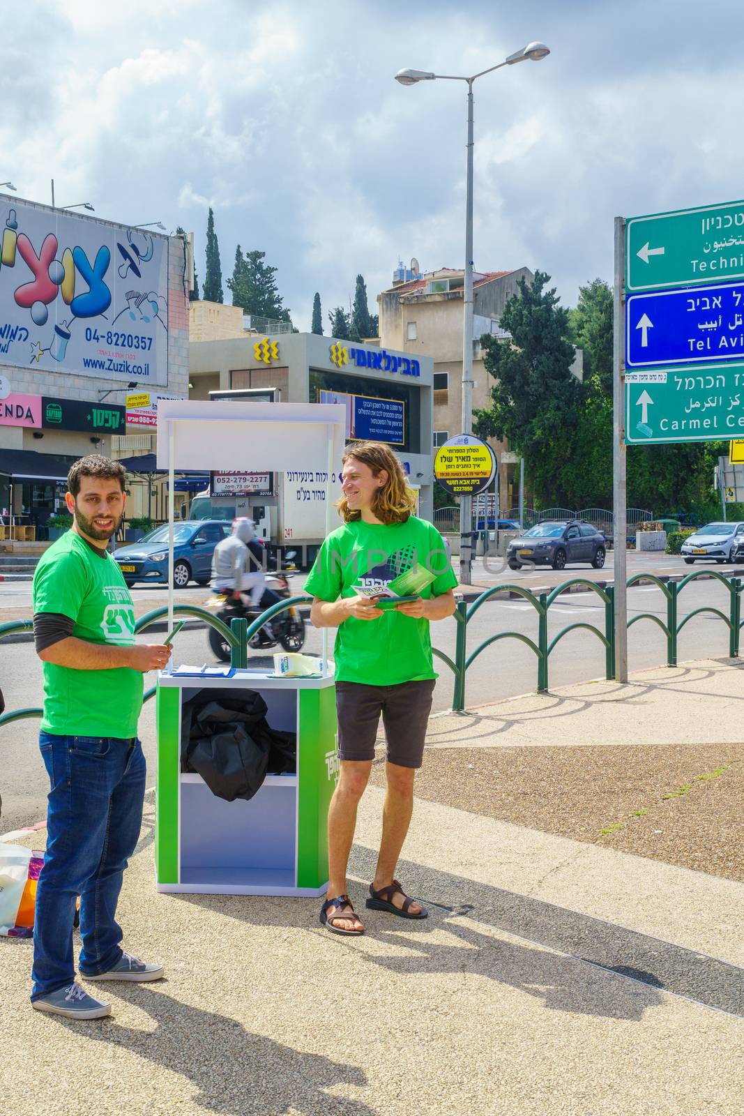 Haifa, Israel - April 05, 2019: Political activists in Ziv square, 4 days before the 2019 elections, in Haifa, Israel
