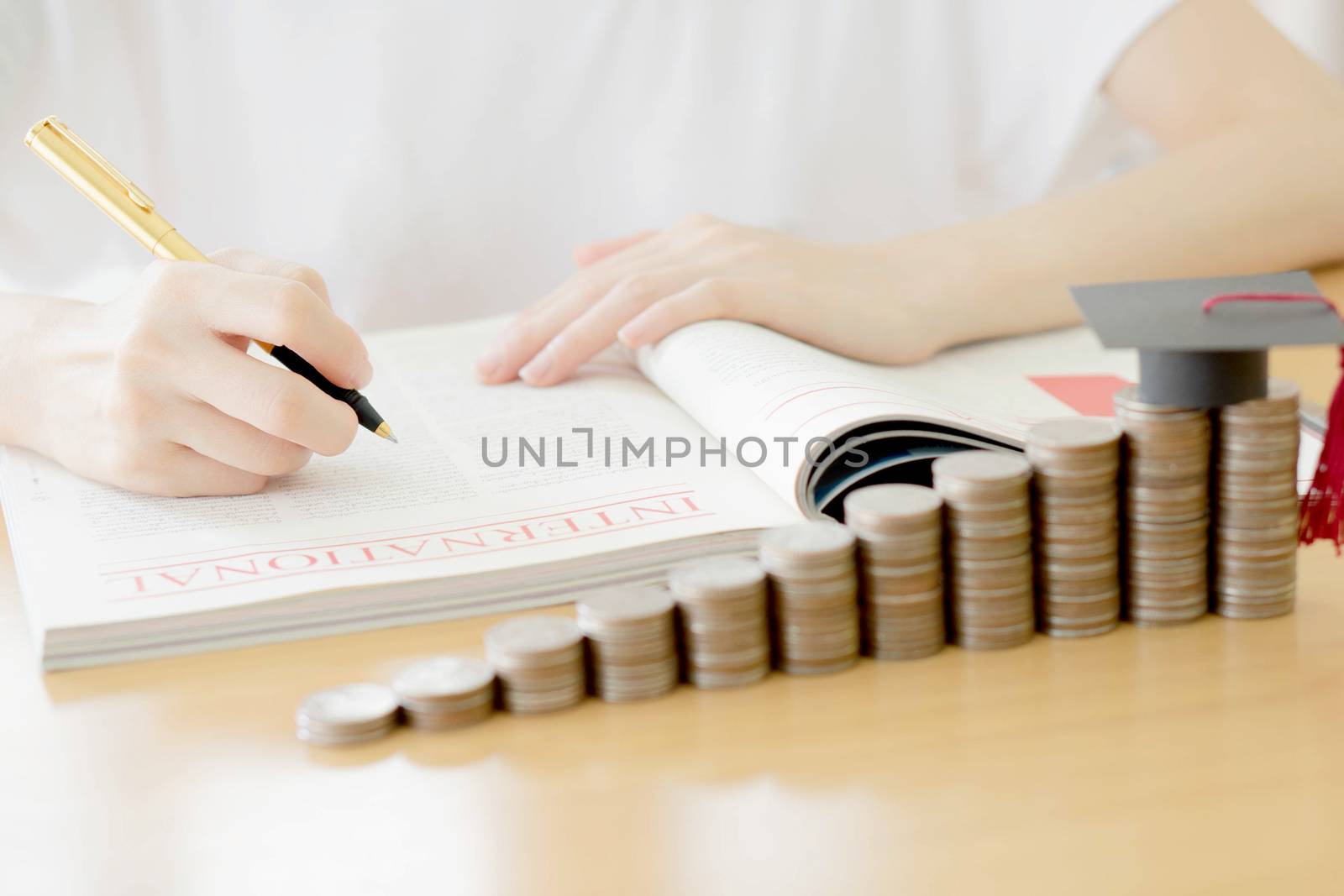 Woman writing on paper by ekachailo