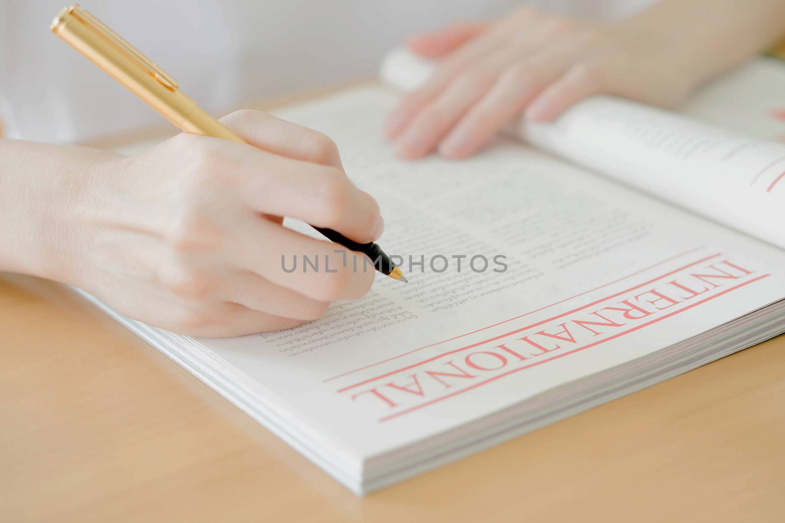 Woman writing on paper