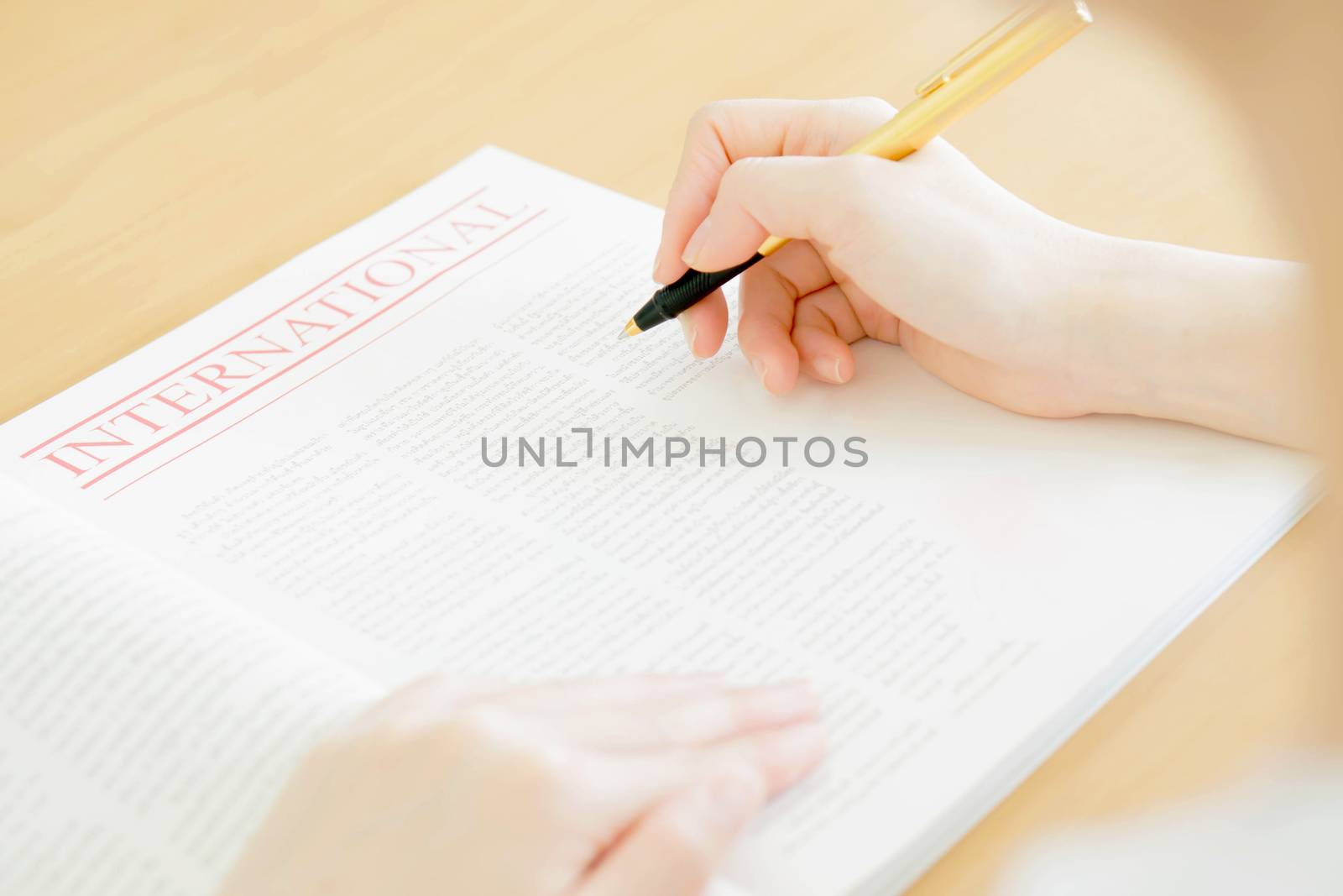 Woman writing on paper