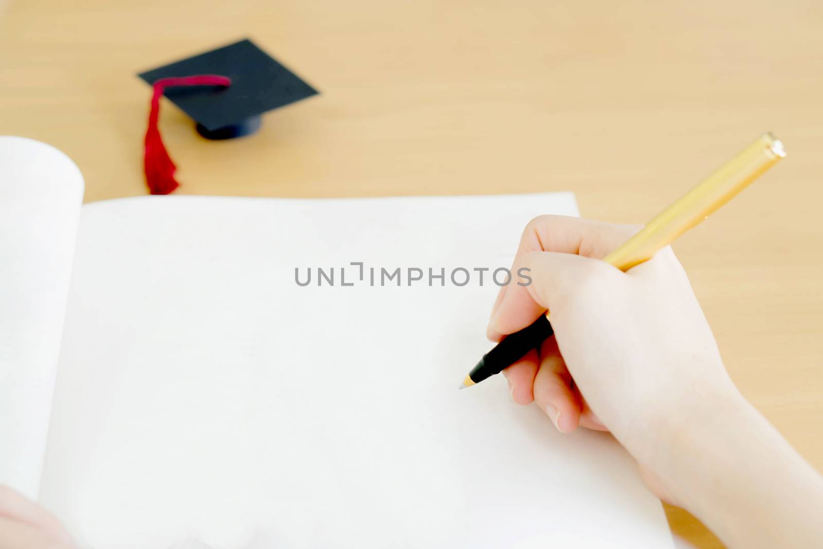 Woman writing on paper