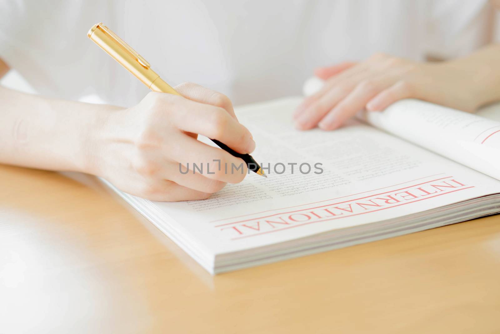 Woman writing on paper