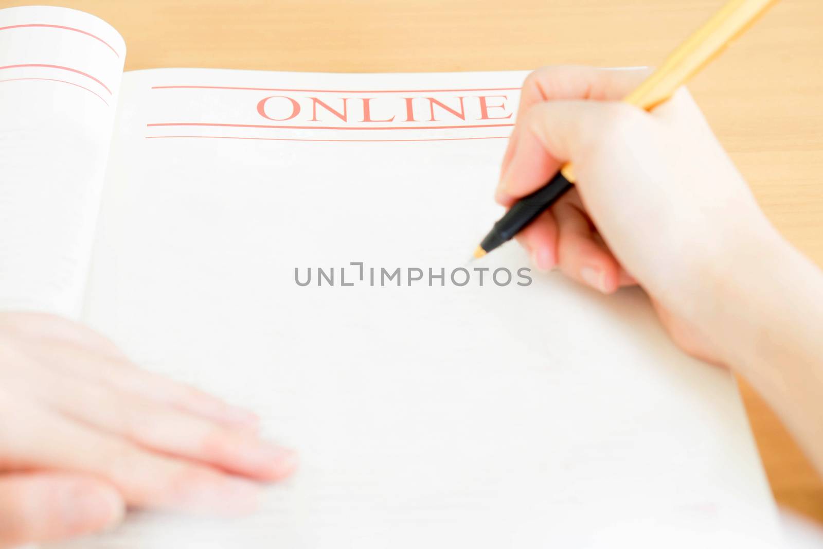 Woman writing on paper