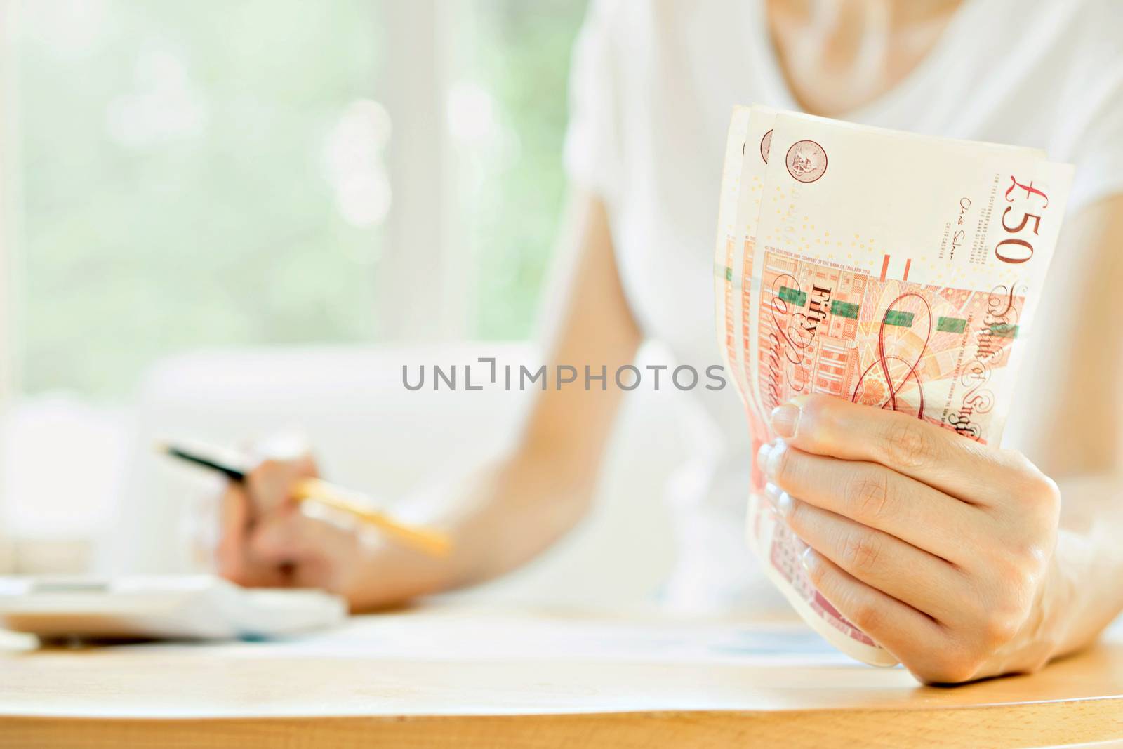 Businesswoman using calculator 