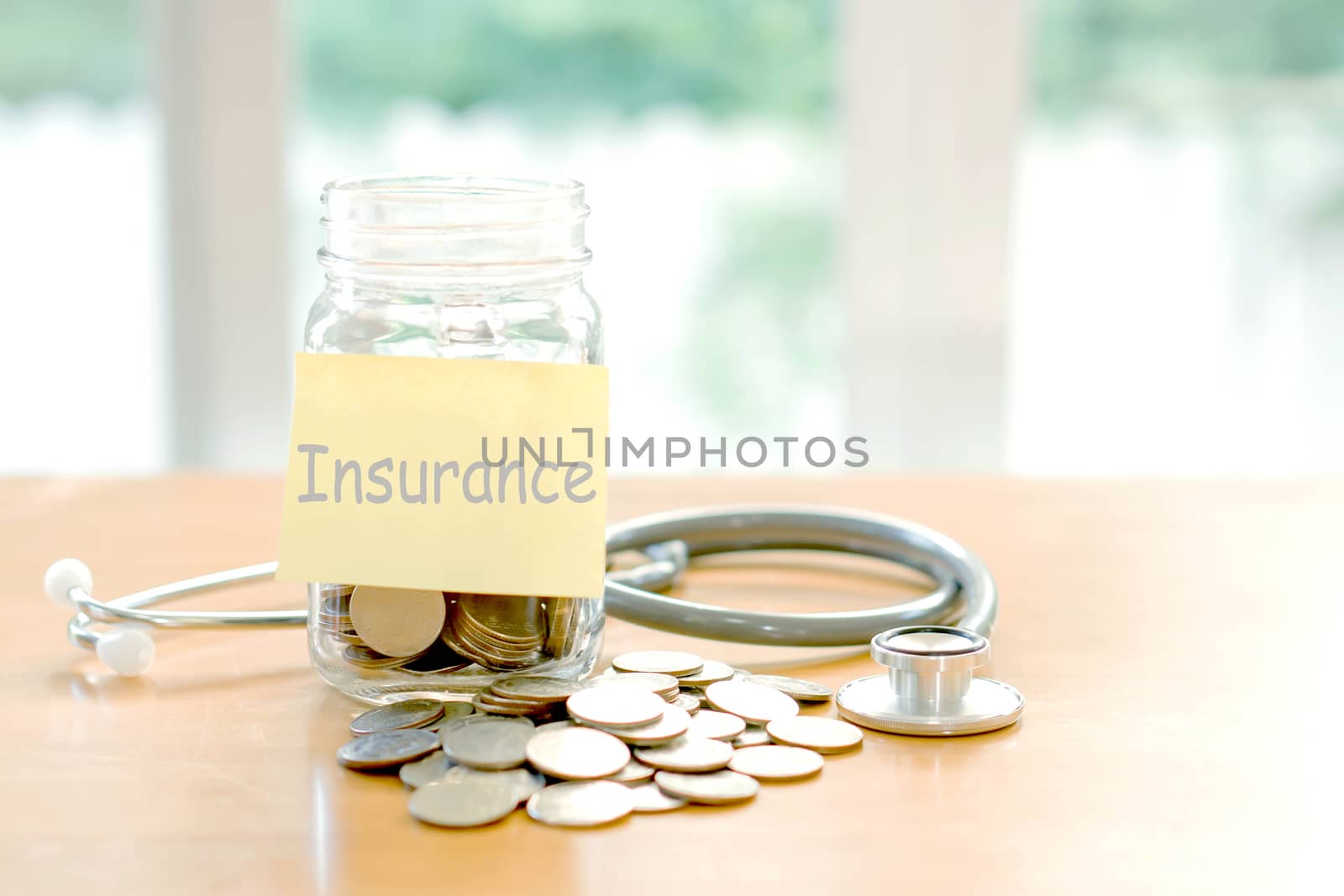 Education budget concept. stethoscopes money savings in a glass