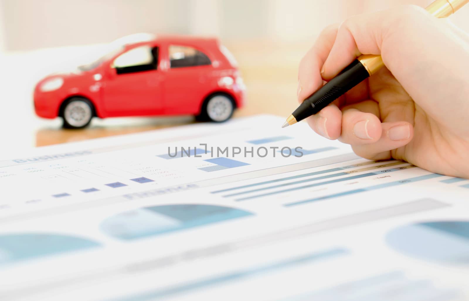 Businesswoman holding a pen and analyze data