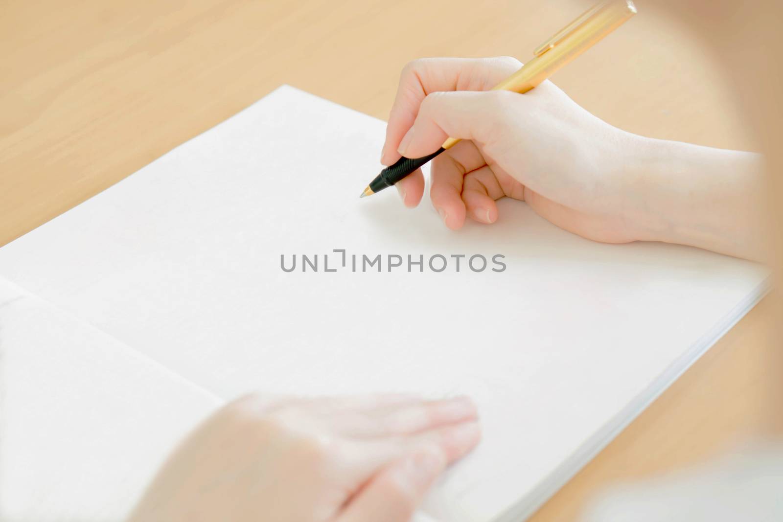 Woman writing on paper